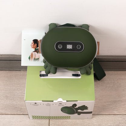 Green neck massager on a white box with a wooden floor background