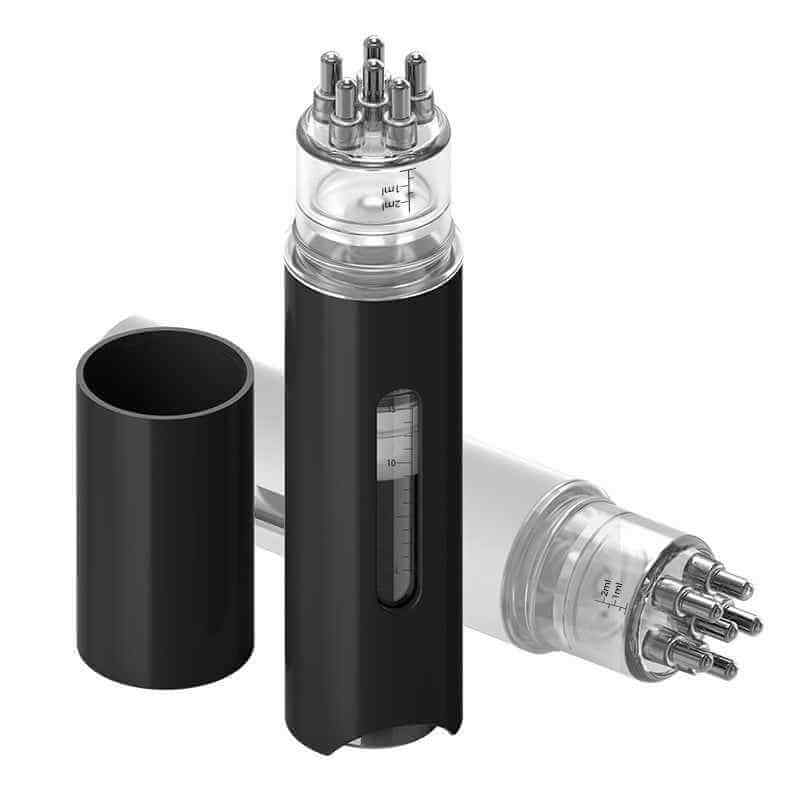 Hair growth applicator showing roller ball mechanism and comb teeth design