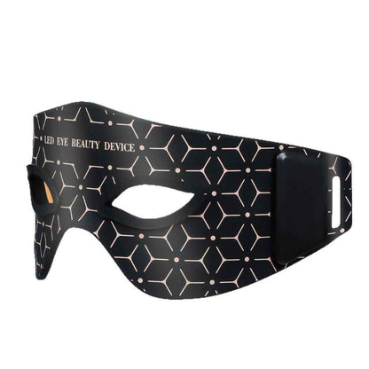 Close-up of eye massager controls showing heat and massage settings